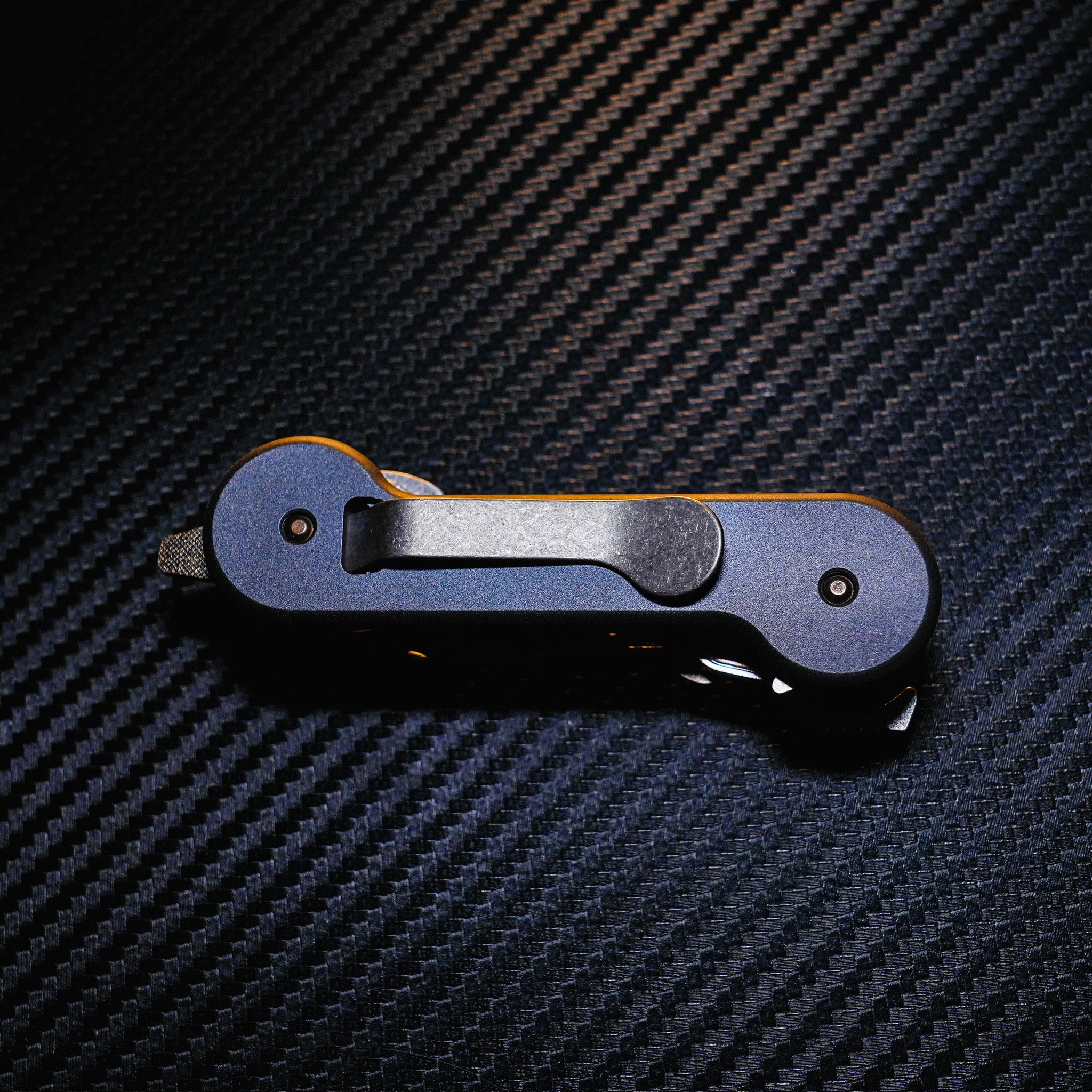 Midnight Titanium KeyBar Key and Tool Holder closed back with standard titanium pocket clip.